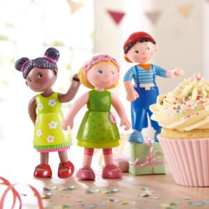 Three Little Friends figures with a cupcake and presents on a festive background