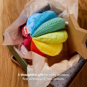 A colorful fabric ball inside an open gift box lined with tissue paper. Text reads 