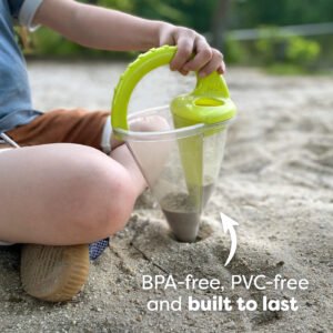 Child using a HABA Spilling Funnel with a green handle to dig in the sand. Text reads 